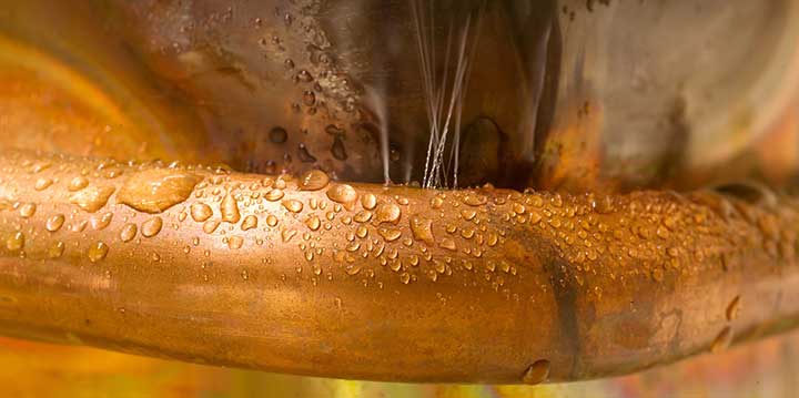 Water leaking from pinholes in copper pipe