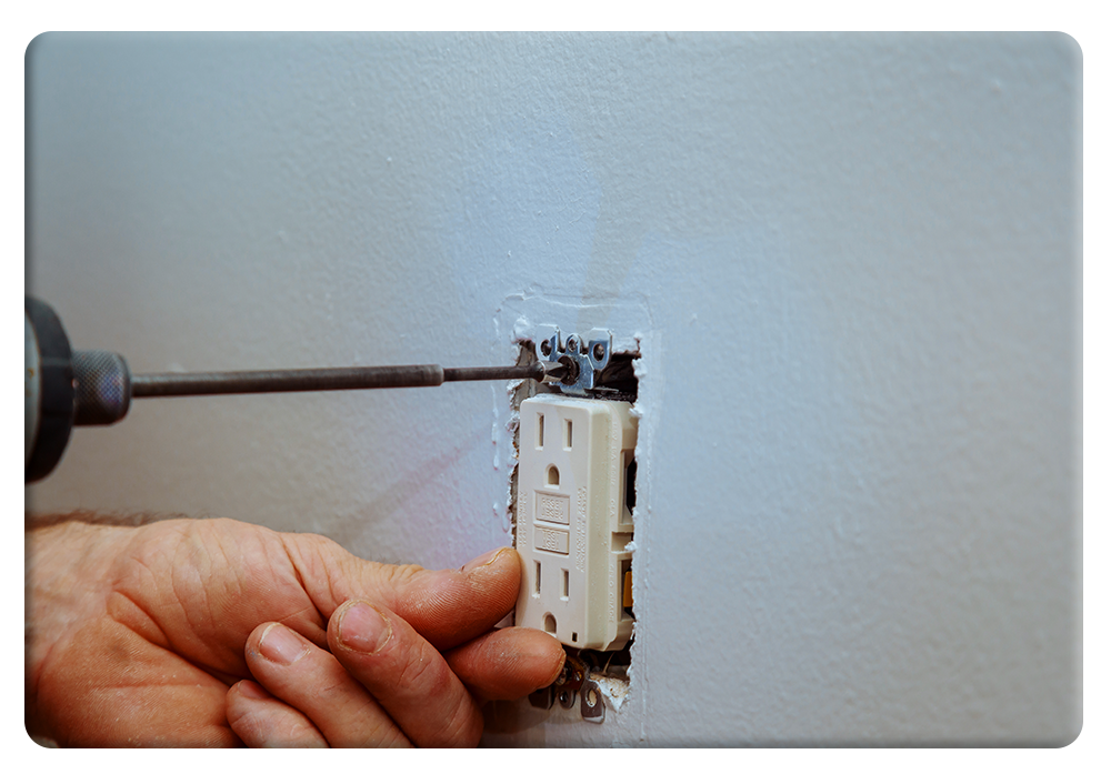 electrician replacing an outlet