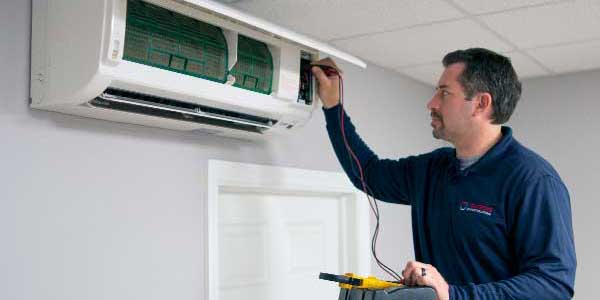 Technician testing a ductless system